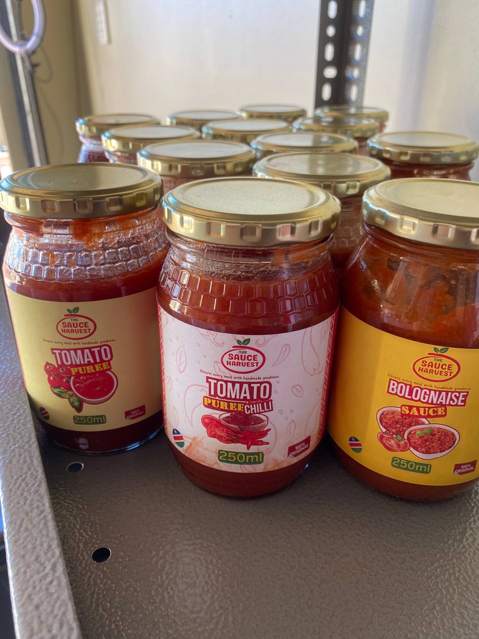 Different tomato sauces packed in glass containers
